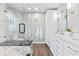 Modern bathroom with marble accents, glass shower door and dual sink vanity at 88 Summer Lake Pl, Dallas, GA 30157