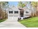 Charming split-level home featuring a two-car garage and manicured lawn on a lush lot at 88 Summer Lake Pl, Dallas, GA 30157