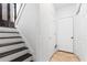 Hallway with stairs, coat closet, and neutral-colored walls at 88 Summer Lake Pl, Dallas, GA 30157