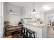 Cozy kitchen area featuring modern white cabinets, granite countertops, and barstool seating at 88 Summer Lake Pl, Dallas, GA 30157