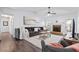 Bright living room featuring a stone fireplace, vaulted ceiling, and sliding door access at 88 Summer Lake Pl, Dallas, GA 30157
