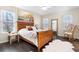 Cozy main bedroom with wood accents, ample natural light and decorative wall art at 88 Summer Lake Pl, Dallas, GA 30157