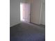 Bedroom featuring gray carpet and a view into the next room at 1085 Mainstreet Valley Dr, Stone Mountain, GA 30088