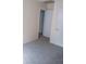 Bedroom featuring gray carpet and a view into the next room at 1085 Mainstreet Valley Dr, Stone Mountain, GA 30088