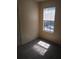 Bedroom featuring gray carpet and window offering plenty of natural light at 1085 Mainstreet Valley Dr, Stone Mountain, GA 30088