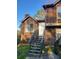 Inviting two-story home featuring a welcoming front entrance and landscaped yard at 1085 Mainstreet Valley Dr, Stone Mountain, GA 30088
