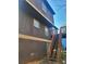 The exterior of the home features durable siding and multiple windows to let in light at 1085 Mainstreet Valley Dr, Stone Mountain, GA 30088