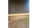 View of the home's siding and foundation, with simple landscaping at 1085 Mainstreet Valley Dr, Stone Mountain, GA 30088