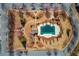 Stunning aerial view of a community pool, clubhouse, playground, and landscaped grounds in a well-maintained neighborhood at 2033 Fosco Dr, Duluth, GA 30097