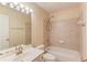 Bathroom features a tub, tiled shower, single sink and framed mirror at 2033 Fosco Dr, Duluth, GA 30097