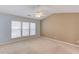Spacious bedroom with large windows and a vaulted ceiling at 2033 Fosco Dr, Duluth, GA 30097