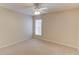 This bedroom features a ceiling fan and a window at 2033 Fosco Dr, Duluth, GA 30097