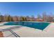 Community pool with protective cover and seasonal trees at 2033 Fosco Dr, Duluth, GA 30097