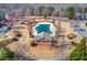 Aerial view of community pool surrounded by trees and landscaping at 2033 Fosco Dr, Duluth, GA 30097