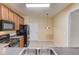 Well-lit kitchen with stainless steel appliances, granite countertops, and ample cabinet space at 2033 Fosco Dr, Duluth, GA 30097
