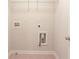 A utility room with connections for laundry appliances and shelving for storage at 2033 Fosco Dr, Duluth, GA 30097