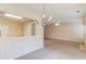 Bright and airy living room featuring neutral walls, a chandelier, and an open floor plan at 2033 Fosco Dr, Duluth, GA 30097