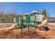 A vibrant community playground with slides, climbing structures, and soft landing surface at 2033 Fosco Dr, Duluth, GA 30097