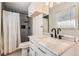 Bathroom features a shower with subway tile, toilet, marble vanity and sink, and gray accents at 3045 Riviera Nw Dr, Conyers, GA 30012