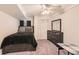 Bedroom with carpet, a ceiling fan, closet and dark wood dresser at 3045 Riviera Nw Dr, Conyers, GA 30012