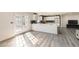 Bright kitchen features a center island with marble countertops, stainless appliances, and hardwood flooring at 3045 Riviera Nw Dr, Conyers, GA 30012