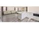 The kitchen with marble countertops is next to the living room for easy and flexible living at 3045 Riviera Nw Dr, Conyers, GA 30012