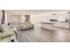 Open living space with hardwood floors, a modern kitchen, and comfortable seating at 3045 Riviera Nw Dr, Conyers, GA 30012