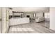 Spacious living space with hardwood floors, a modern kitchen, and comfortable seating at 3045 Riviera Nw Dr, Conyers, GA 30012