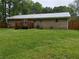 Exterior of the home, showing the backyard, deck, and new fence at 401 Peggy Ln, Villa Rica, GA 30180