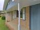 Close up of the brick exterior with classic blue shutters and trim at 401 Peggy Ln, Villa Rica, GA 30180