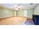 Spacious living room features wood-look floors and a brick fireplace at 401 Peggy Ln, Villa Rica, GA 30180