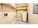 Utility room with water heater and storage shelves at 401 Peggy Ln, Villa Rica, GA 30180