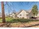 Back view of house featuring large yard and patio at 7238 Hummingbird Ln, Winston, GA 30187