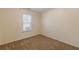 This bedroom features neutral walls, brown carpeting and a window with blinds for soft, natural light at 7238 Hummingbird Ln, Winston, GA 30187