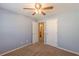 This carpeted bedroom has an open doorway, showing access to other rooms at 7238 Hummingbird Ln, Winston, GA 30187