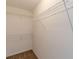 Walk-in closet featuring white wire shelving and neutral colored carpeting at 7238 Hummingbird Ln, Winston, GA 30187