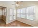 Dining area with hardwood floors with access to the yard through glass paneled doors at 7238 Hummingbird Ln, Winston, GA 30187