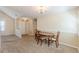Bright dining room with a neutral color scheme, seamlessly connected to other living spaces at 7238 Hummingbird Ln, Winston, GA 30187