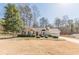 Charming single Gathering home boasting manicured landscaping and a two-car garage at 7238 Hummingbird Ln, Winston, GA 30187