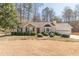 Charming single Gathering home boasting manicured landscaping and a two-car garage at 7238 Hummingbird Ln, Winston, GA 30187