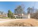 Charming single Gathering home boasting manicured landscaping and a two-car garage at 7238 Hummingbird Ln, Winston, GA 30187