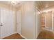 Hallway featuring hardwood-style floors, leading to various rooms in the home at 7238 Hummingbird Ln, Winston, GA 30187