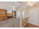 Spacious living room featuring a cozy fireplace, built-in bookshelves, and lots of natural light at 7238 Hummingbird Ln, Winston, GA 30187