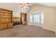 Bright living room features vaulted ceiling, fireplace, built-in bookshelves, and large windows at 7238 Hummingbird Ln, Winston, GA 30187