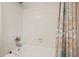 Clean bathroom features white tile shower and patterned shower curtain at 3003 Maple Ln, Alpharetta, GA 30009