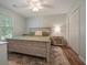 Light and airy bedroom with neutral color scheme and a large, comfortable bed at 3003 Maple Ln, Alpharetta, GA 30009