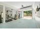 Garage with workout equipment and an open garage door at 3003 Maple Ln, Alpharetta, GA 30009