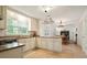 Spacious kitchen with granite countertops, stainless steel appliances, and an open design to the dining area at 3003 Maple Ln, Alpharetta, GA 30009