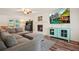 Cozy living room with plush sectional sofa, fireplace, and large screen tv at 3003 Maple Ln, Alpharetta, GA 30009