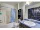 Updated bathroom with shower/tub combo and vanity providing a clean and functional space at 375 Tambec Nw Trce, Lilburn, GA 30047